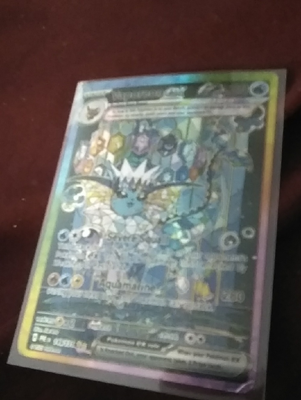Holographic Vaporeon EX Pokémon Card - Blue and Rainbow Foil